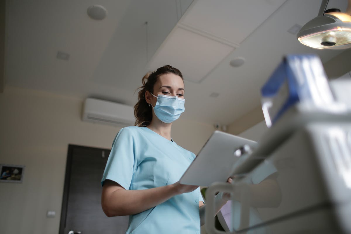 Photo Of Woman Wearing A Surgical Mask