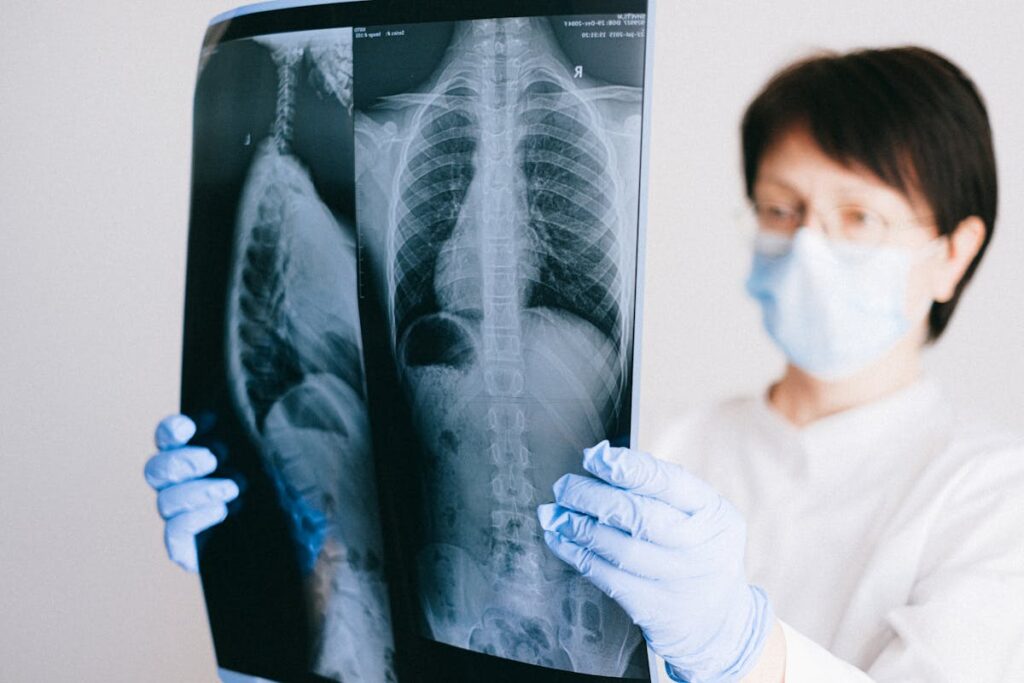 Doctor Looking at Scans of Lungs